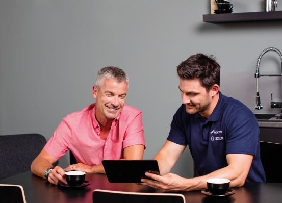 Worcester Bosch accredited engineer explaining new boiler to customer
